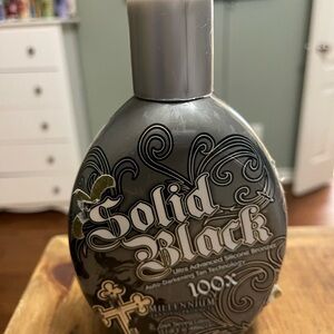 Millennium Solid Black Tanning Lotion - Black and Gold